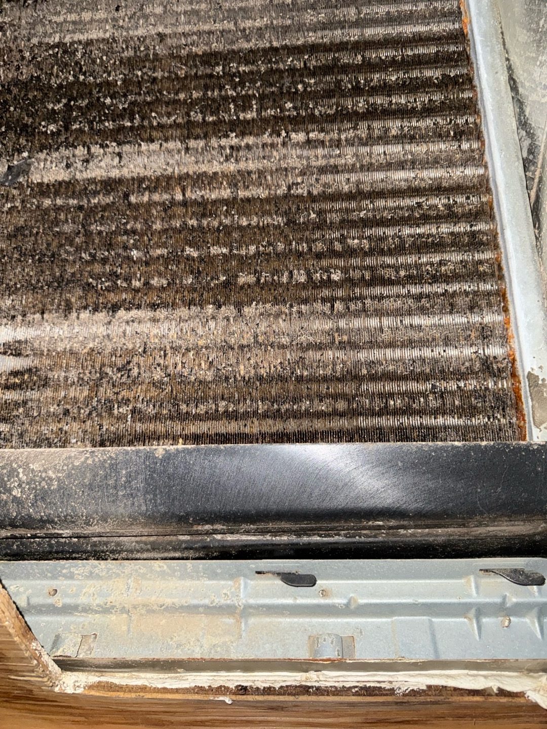 Dust-matted evaporator coil found during AC maintenance in Deltona