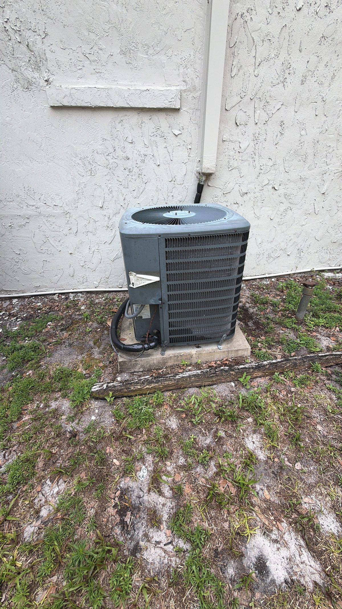 Recording Goodman GSX14 nameplate data during an HVAC replacement estimate in DeBary