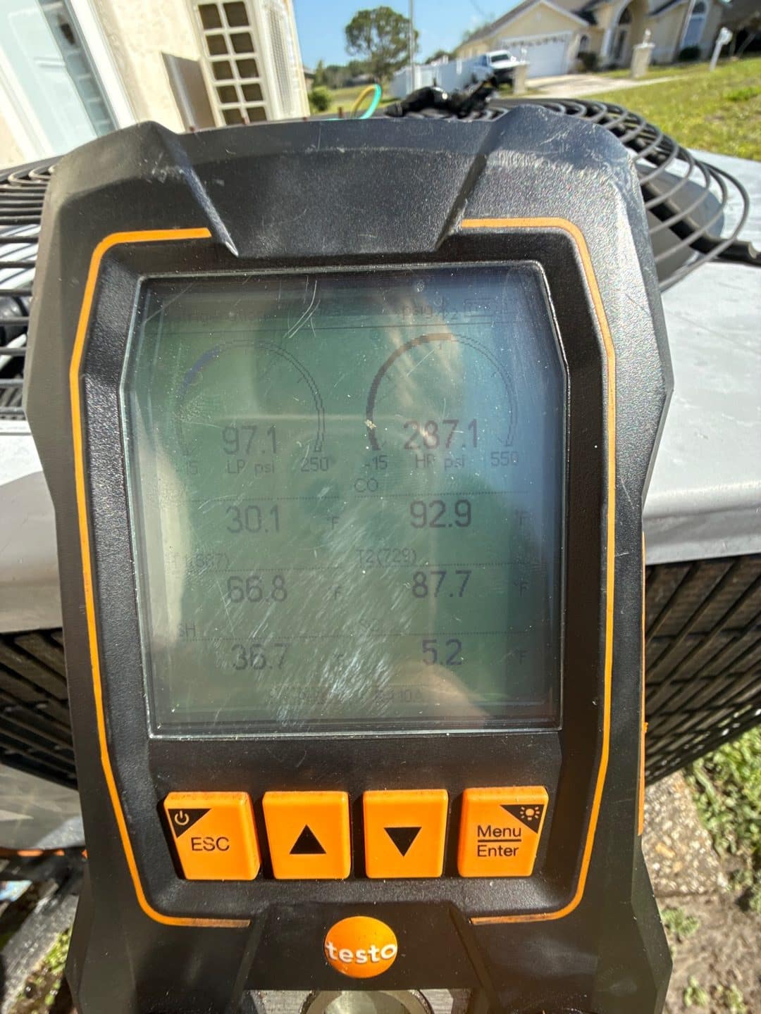 Digital manifold showing refrigerant pressures during AC diagnostics in Deltona