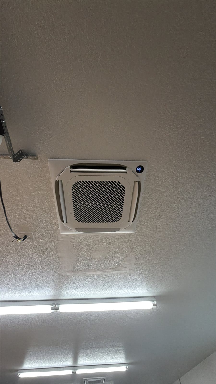 Ductless ceiling cassette installed in Patrick's two-story garage in DeLand
